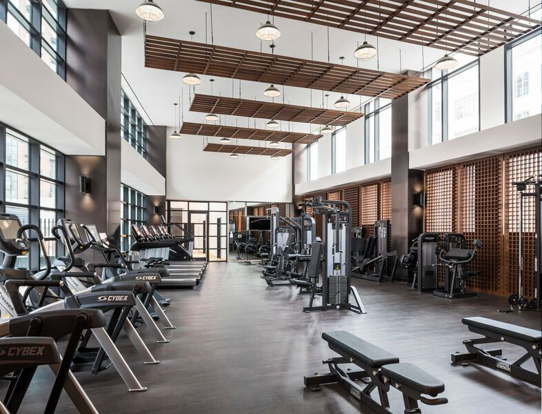 44-28 Purves Street, Unit 19B Queens, NY 11101 - Photo 4 of 19 a view of a room with gym equipment