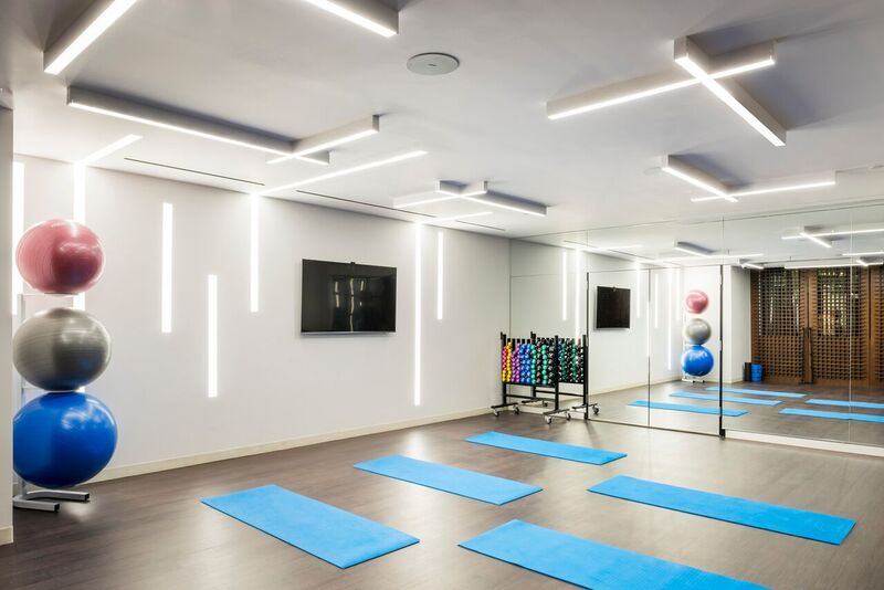 44-28 Purves Street, Unit 19B Queens, NY 11101 - Photo 5 of 19 a living room with furniture and a flat screen tv