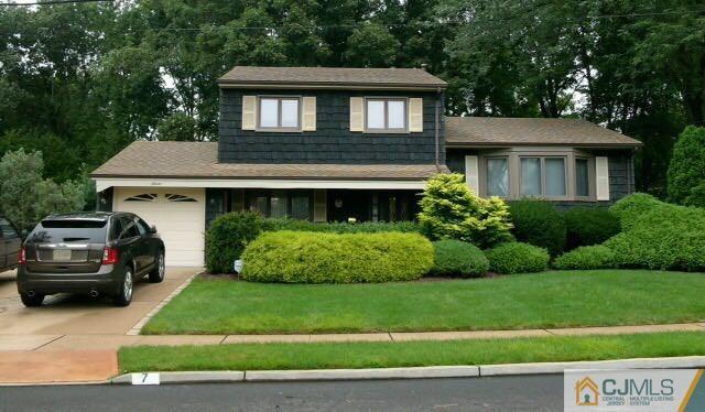 7 Gramercy Road Old Bridge, NJ 08857 - Photo 1 of 24 a front view of a house with a yard