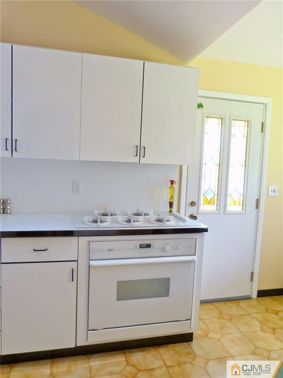 7 Gramercy Road Old Bridge, NJ 08857 - Photo 11 of 24 a stove top oven sitting inside of a kitchen