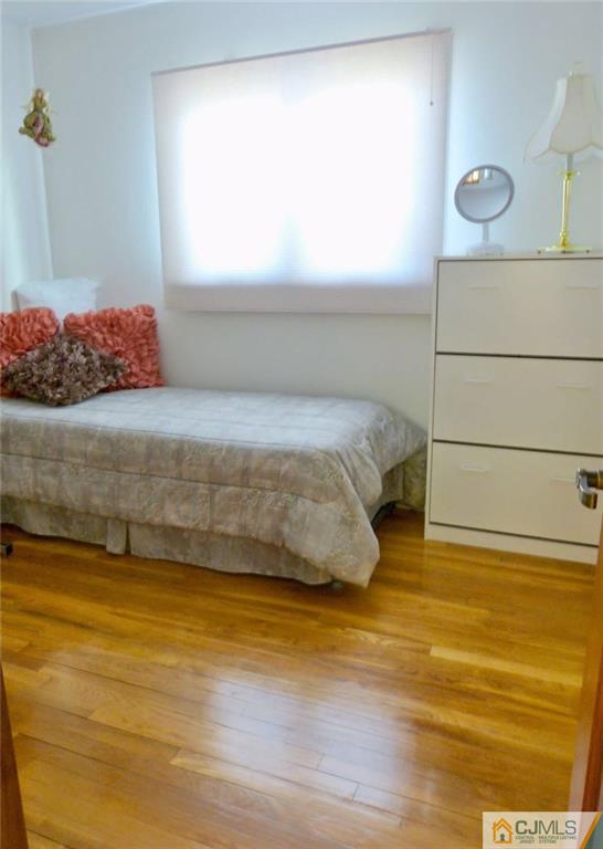 7 Gramercy Road Old Bridge, NJ 08857 - Photo 20 of 24 a bedroom with a bed and window