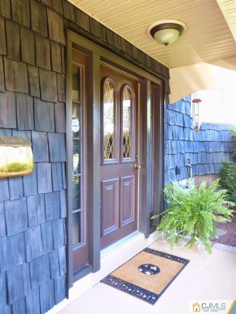 7 Gramercy Road Old Bridge, NJ 08857 - Photo 3 of 24 a front view of a house with a backyard