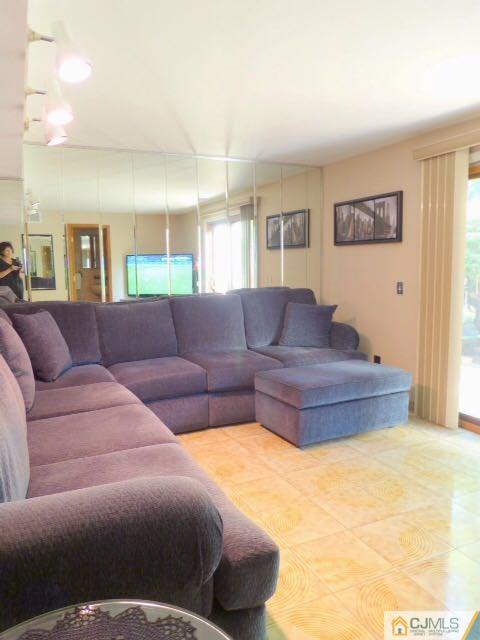 7 Gramercy Road Old Bridge, NJ 08857 - Photo 21 of 24 a living room with a couch and a coffee table