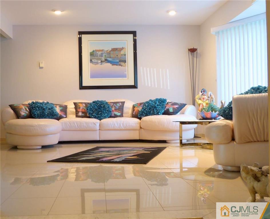 7 Gramercy Road Old Bridge, NJ 08857 - Photo 6 of 24 a living room with furniture and a large mirror