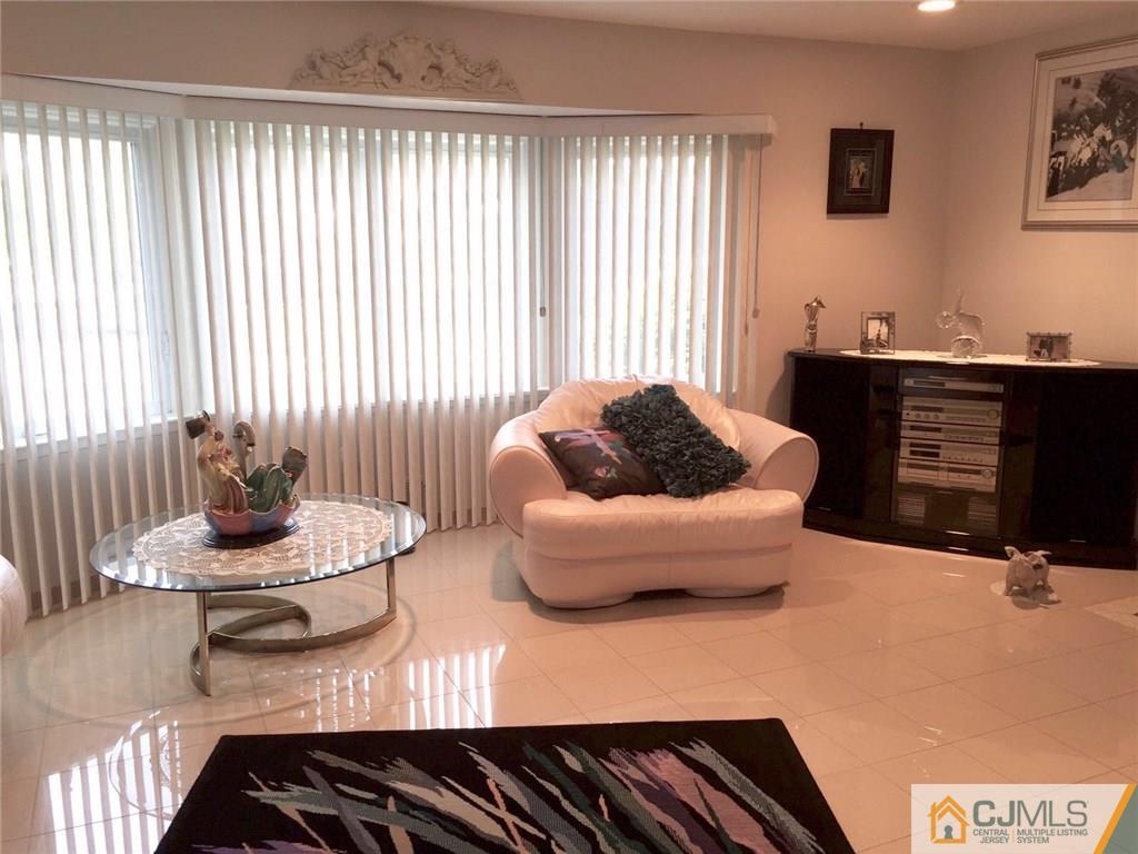 7 Gramercy Road Old Bridge, NJ 08857 - Photo 7 of 24 a living room with furniture and a window