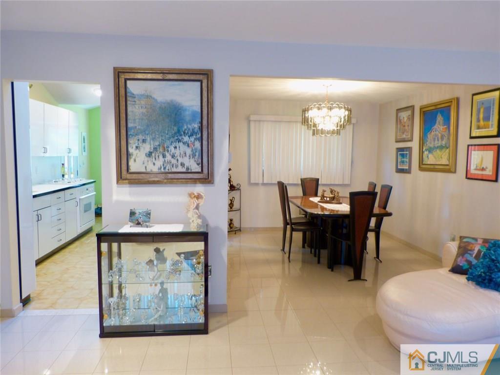 7 Gramercy Road Old Bridge, NJ 08857 - Photo 8 of 24 a view of a dining room with furniture and a chandelier
