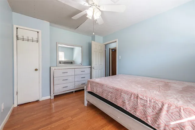 a bedroom with a bed and a dresser