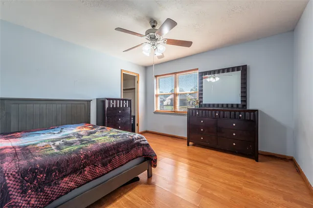 a bedroom with a bed and a dresser