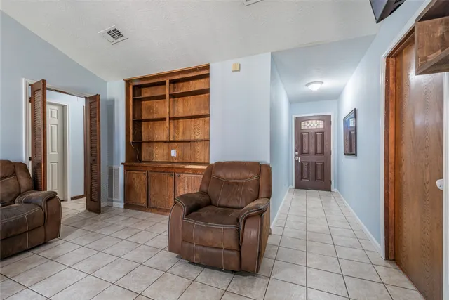 a living room with furniture and a window