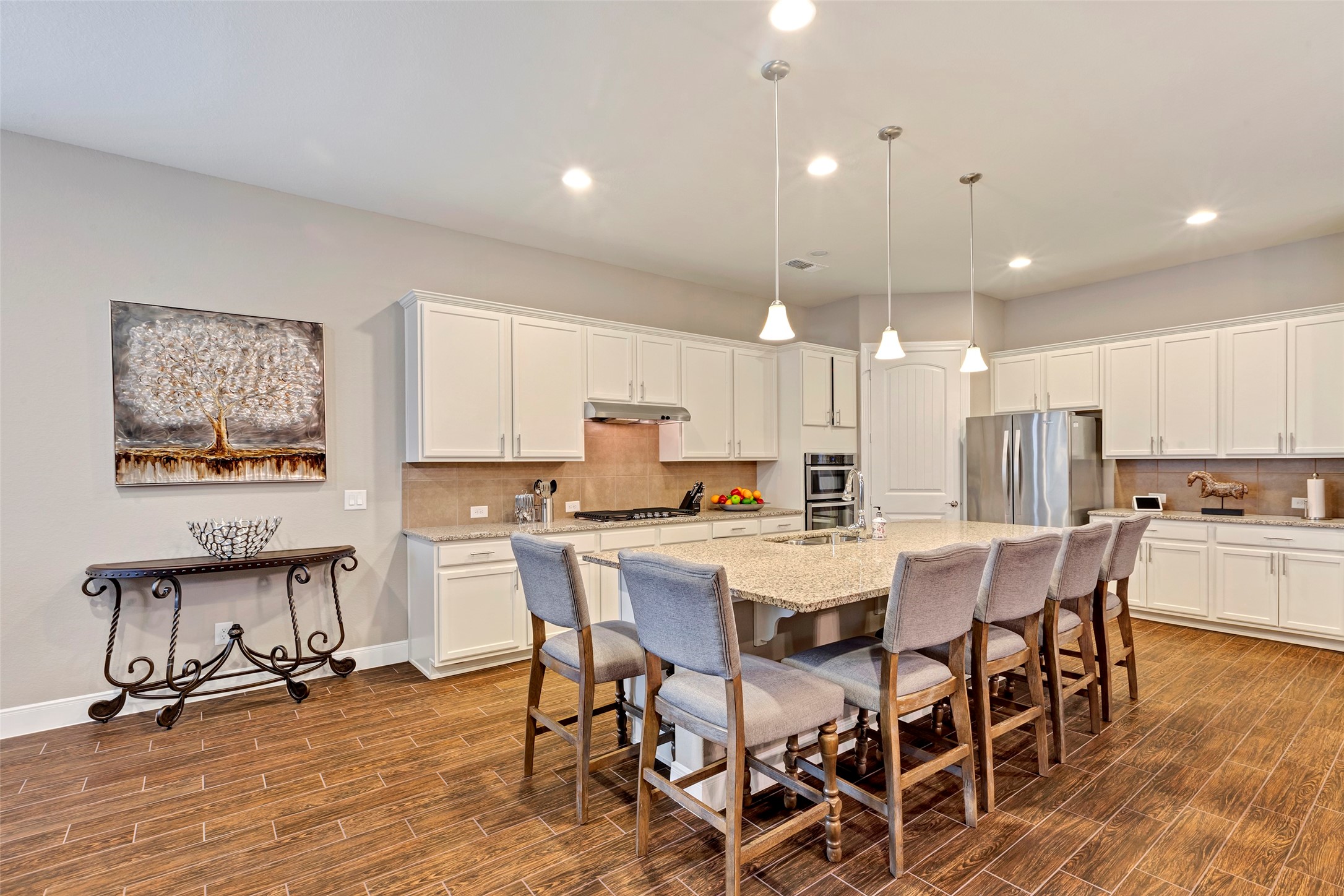 342 Kerry Bog Lane Spring, TX 77382 - Photo 11 of 39 a view of a dining room with furniture wooden floor and a rug