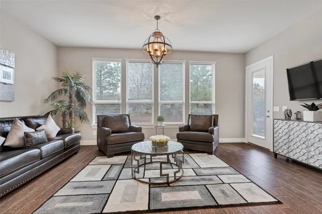 a view of a dining room with furniture and wooden floor