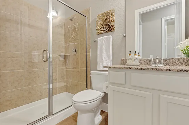 a bathroom with a granite countertop sink mirror and a