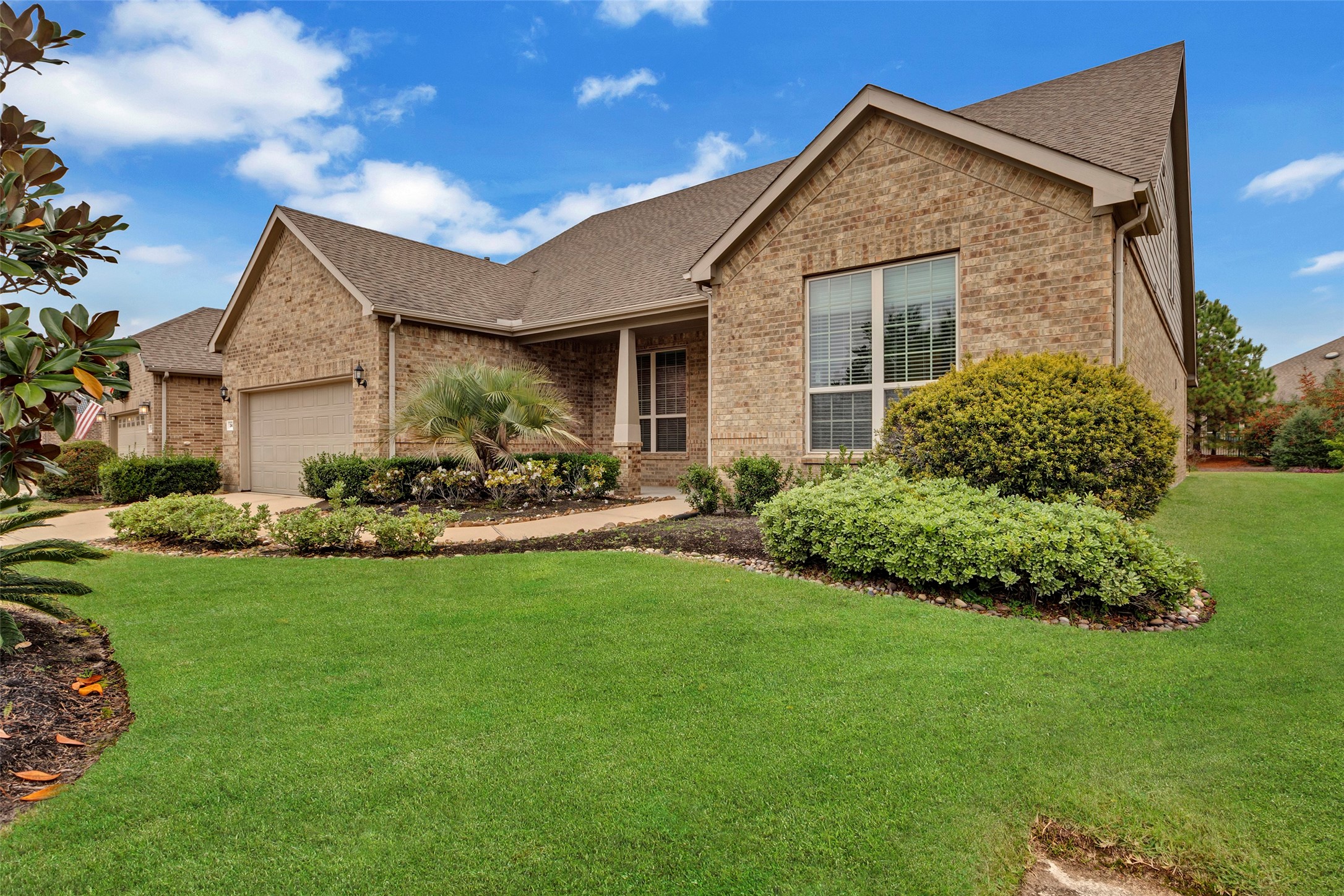 342 Kerry Bog Lane Spring, TX 77382 - Photo 38 of 39 a front view of a house with a garden and plants