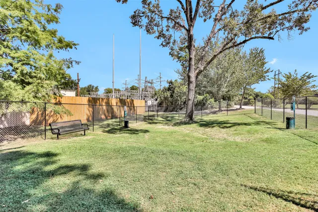 a view of yard with swimming pool and sitting area