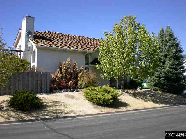 2910 Alpine Creek Road Reno, NV 89519 - Photo 3 of 9 a view of a house with a small yard and potted plants