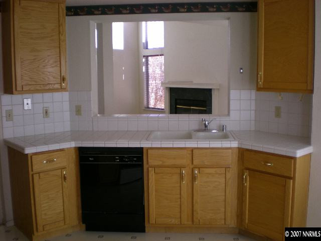 2910 Alpine Creek Road Reno, NV 89519 - Photo 8 of 9 a kitchen with a sink and cabinets