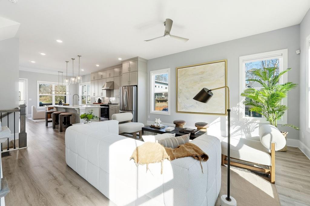 1363 Pavilion Street Southeast, Unit 44 Atlanta, GA 30316 - Photo 7 of 28 a living room with furniture and a large window
