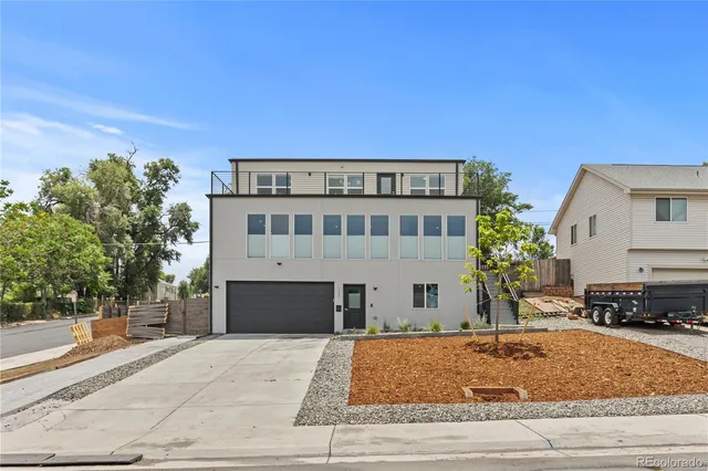 a view of a building with a yard