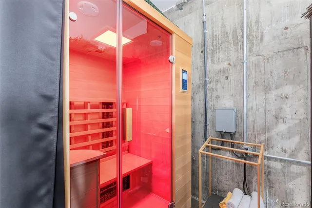 a room with gym equipment and a flat screen tv