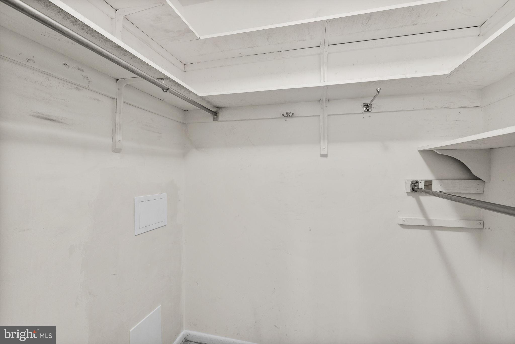 6300 Red Cedar Place, Unit 310 Baltimore, MD 21209 - Photo 17 of 28 a view of a room with racks on the wall