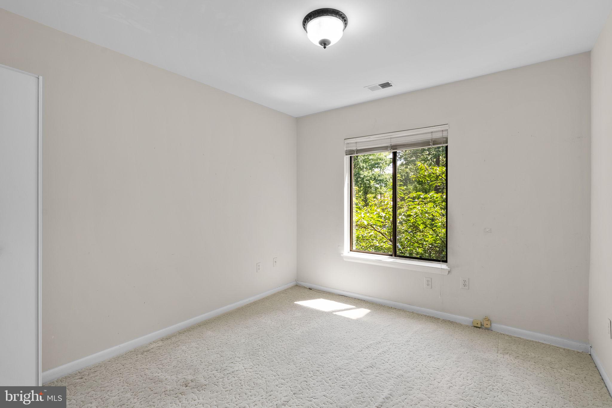 6300 Red Cedar Place, Unit 310 Baltimore, MD 21209 - Photo 19 of 28 an empty room with a window