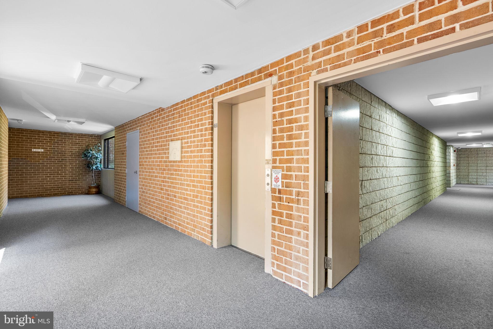 6300 Red Cedar Place, Unit 310 Baltimore, MD 21209 - Photo 2 of 28 a view of hallway with stairs