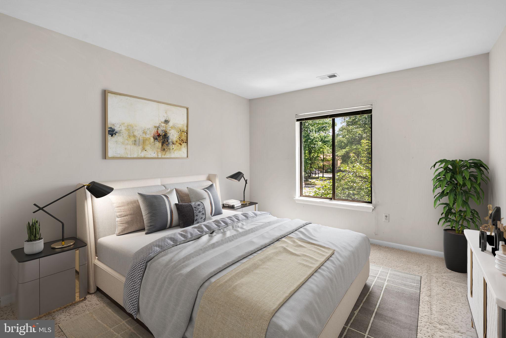 6300 Red Cedar Place, Unit 310 Baltimore, MD 21209 - Photo 22 of 28 a bedroom with bed and a window