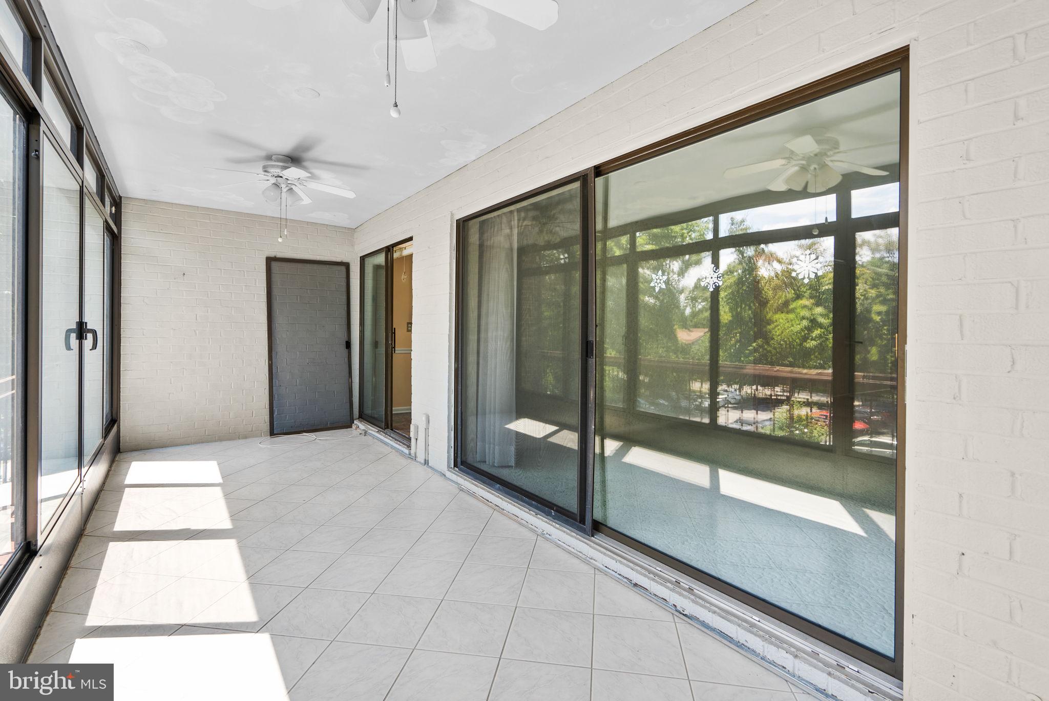 6300 Red Cedar Place, Unit 310 Baltimore, MD 21209 - Photo 27 of 28 a view of an empty room with glass door