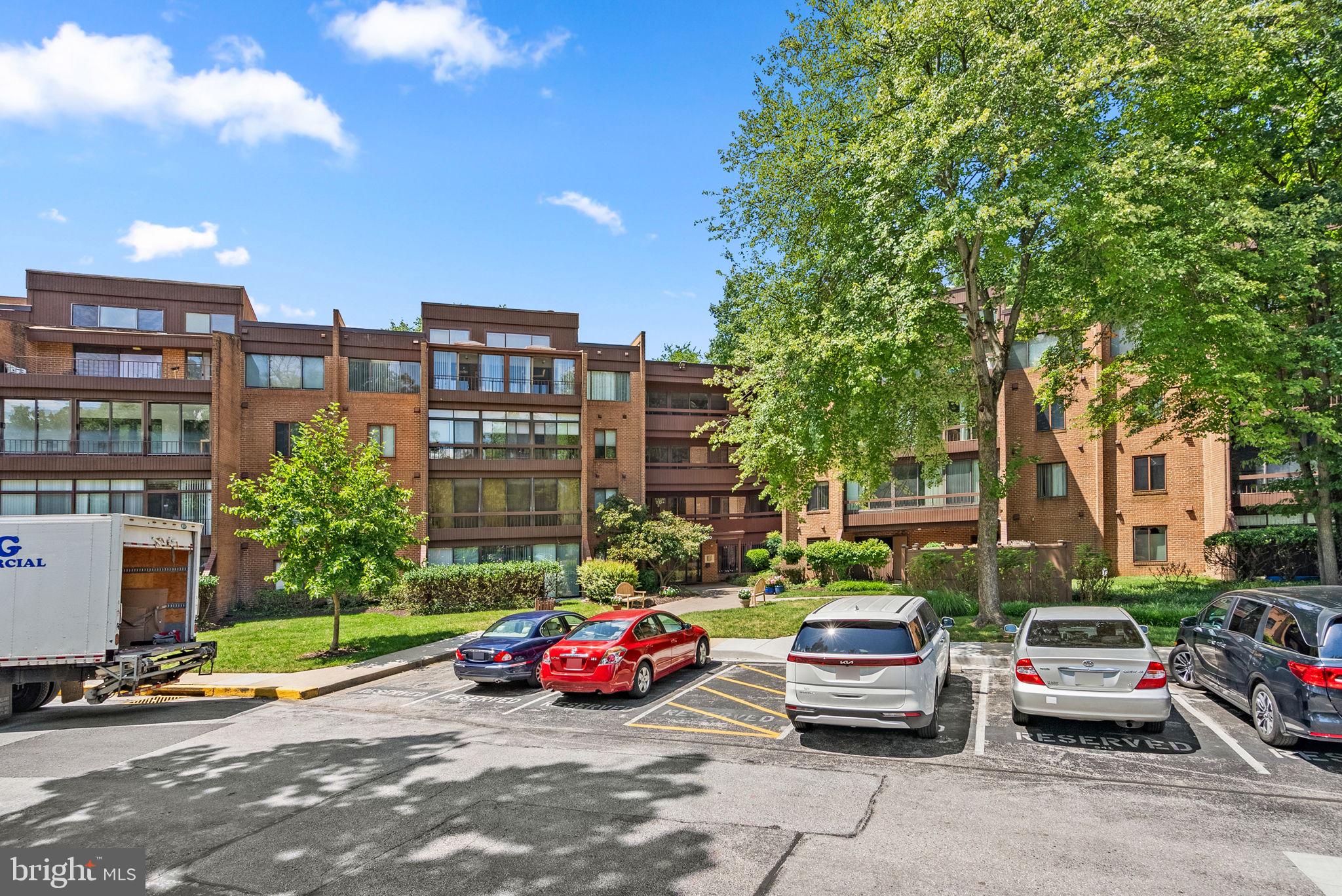 6300 Red Cedar Place, Unit 310 Baltimore, MD 21209 - Photo 28 of 28 a cars parked in front of a building
