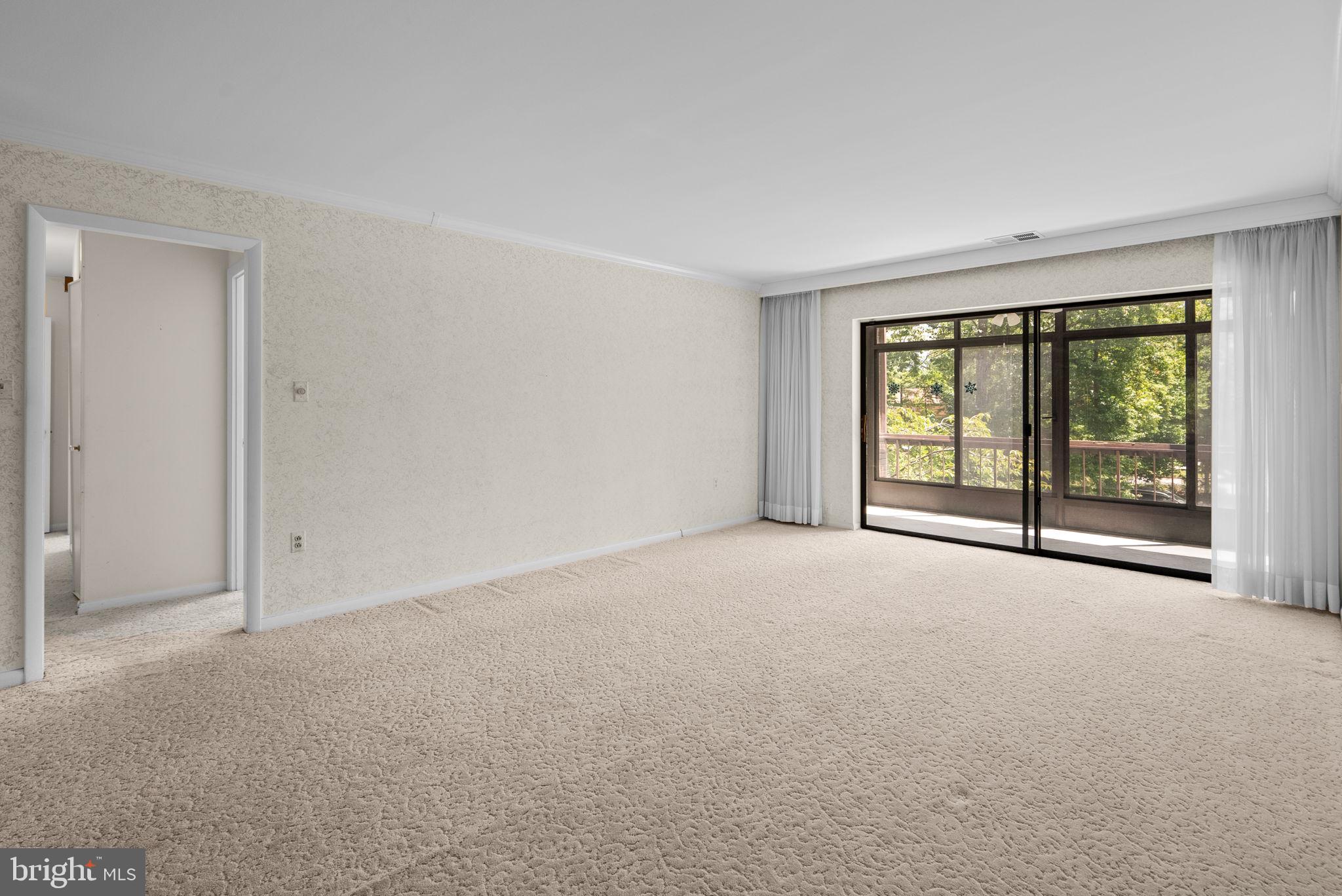 6300 Red Cedar Place, Unit 310 Baltimore, MD 21209 - Photo 5 of 28 a view of an empty room with a window