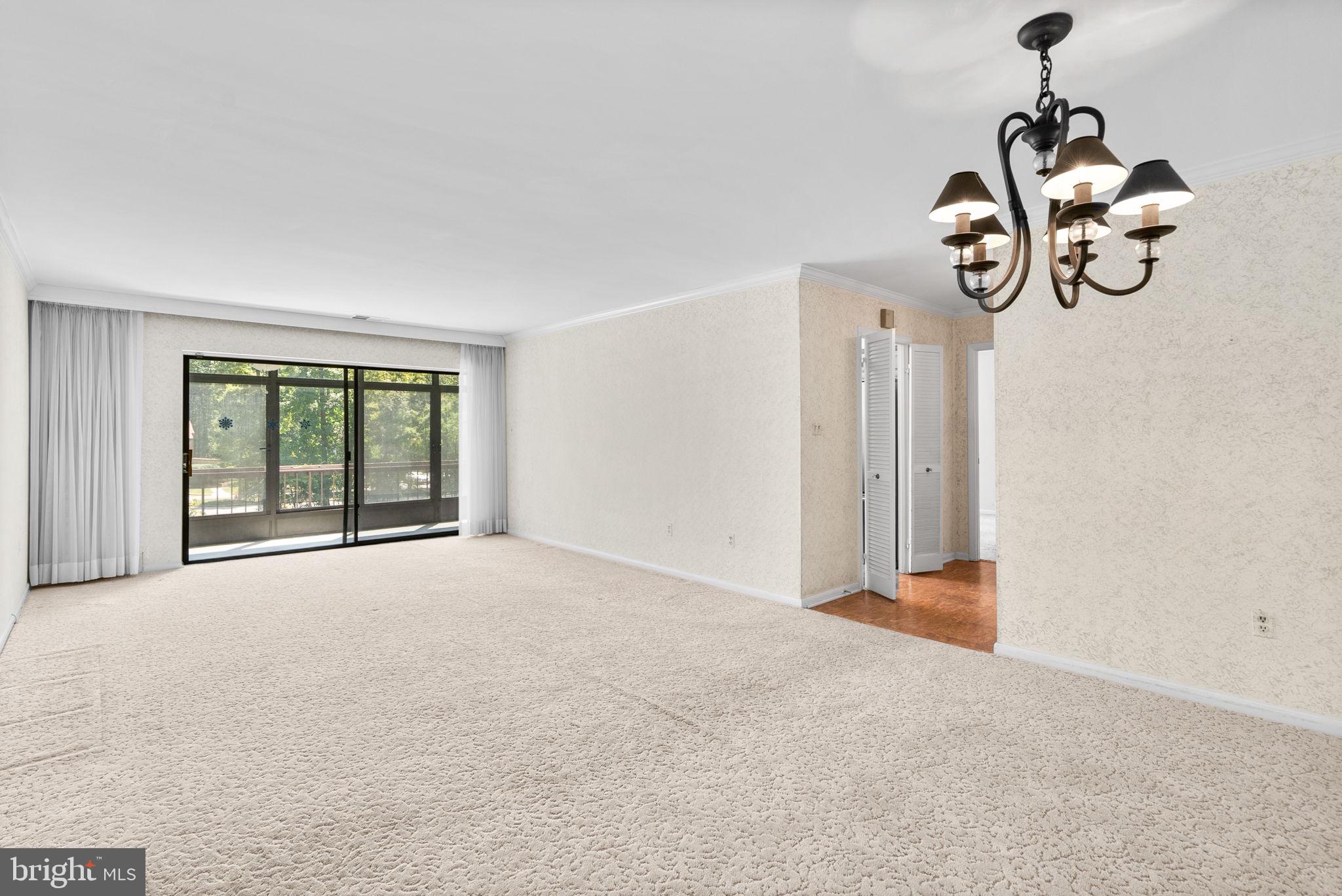 6300 Red Cedar Place, Unit 310 Baltimore, MD 21209 - Photo 7 of 28 a view of an empty room with windows