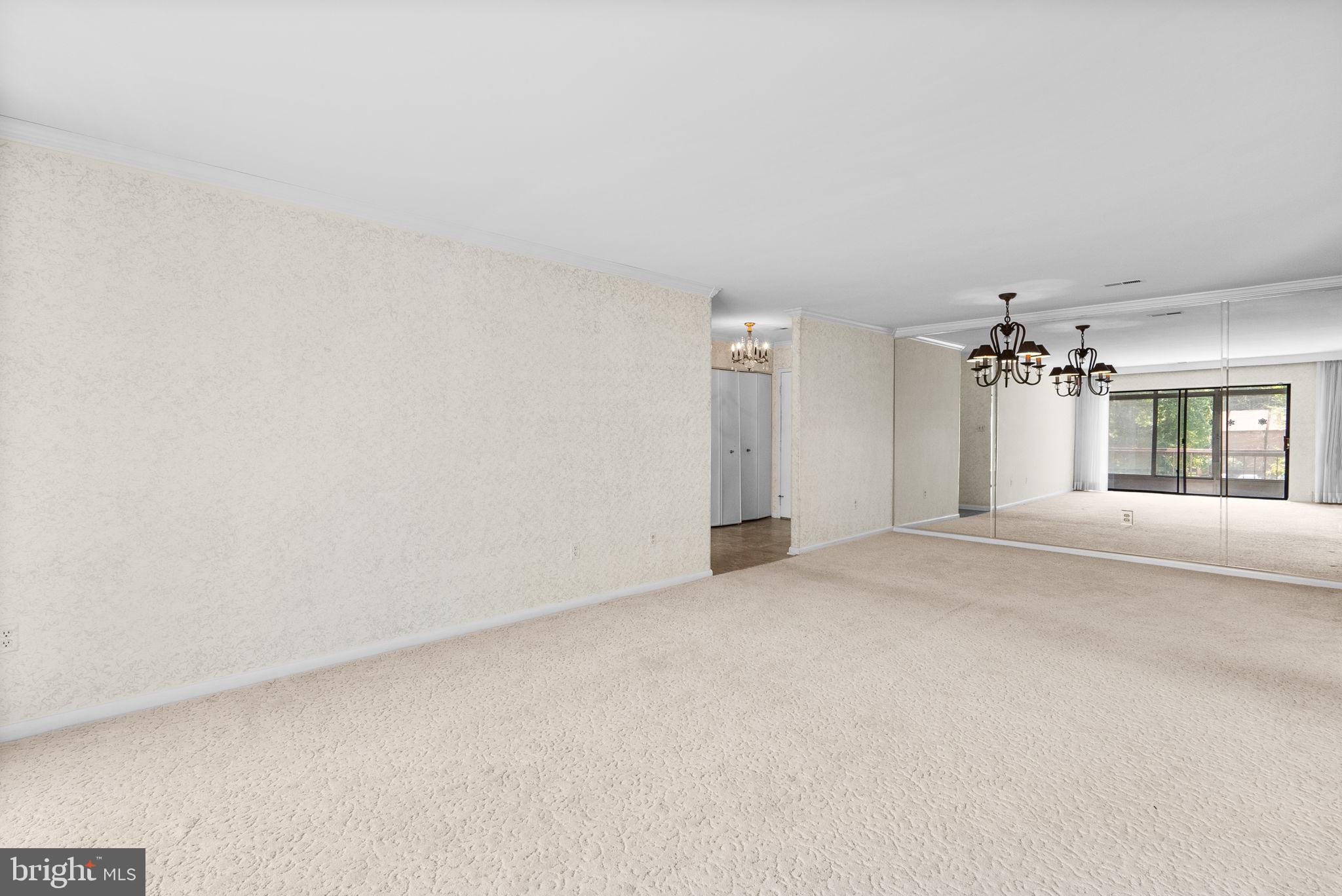 6300 Red Cedar Place, Unit 310 Baltimore, MD 21209 - Photo 9 of 28 a view of a livingroom with a chandelier