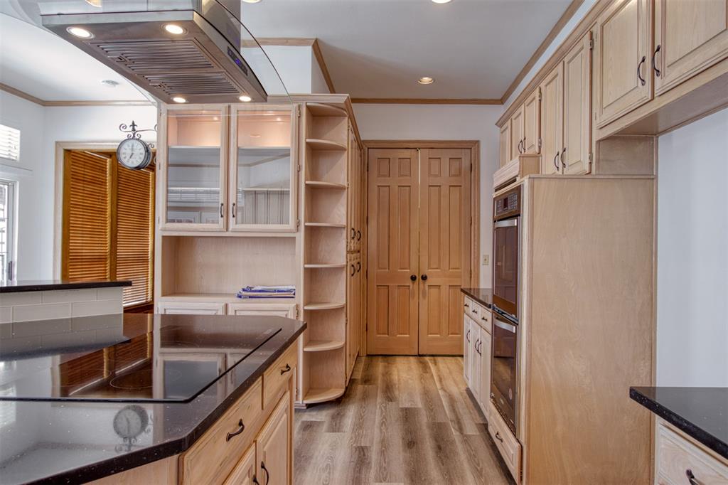 4564 Hitching Post Lane Plano, TX 75024 - Photo 13 of 40 a kitchen with a sink and a refrigerator