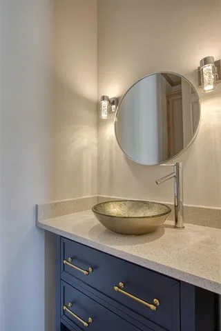 a close view of bathroom sink and mirror