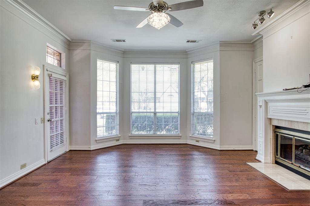 4564 Hitching Post Lane Plano, TX 75024 - Photo 17 of 40 a view of an empty room with wooden floor and a window