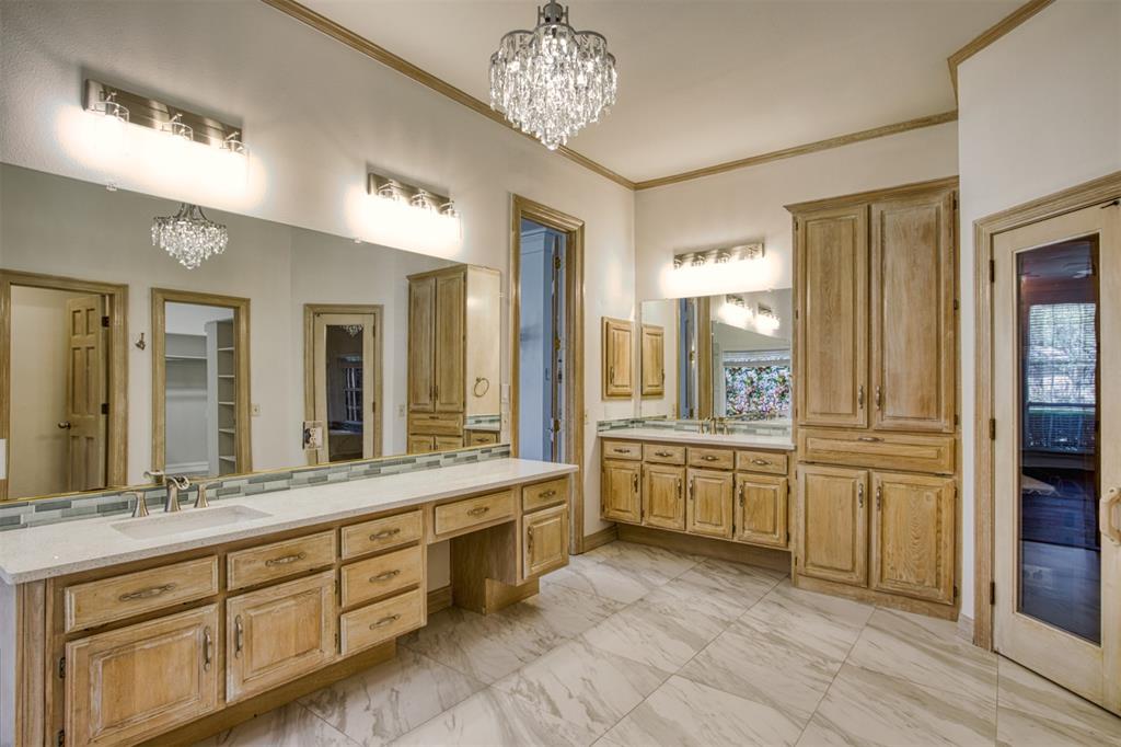 4564 Hitching Post Lane Plano, TX 75024 - Photo 18 of 40 a large bathroom with a granite countertop double vanity sink a mirror and a bathtub