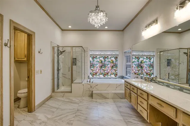 a large spacious bathroom with a large tub shower and sink