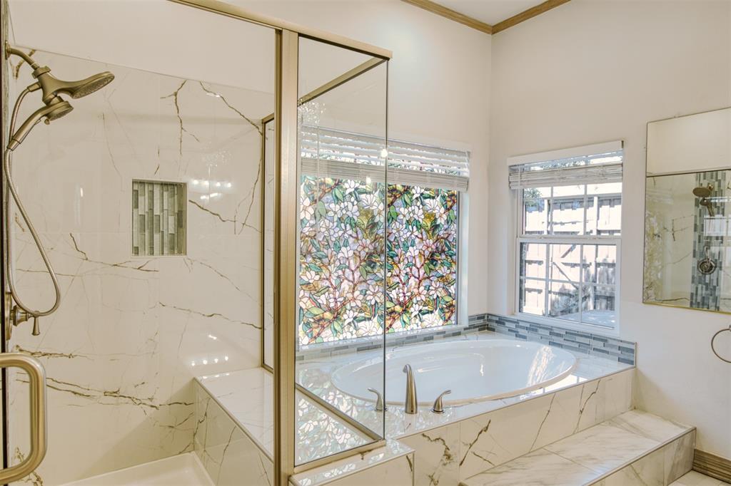4564 Hitching Post Lane Plano, TX 75024 - Photo 20 of 40 a bathroom with a tub and a large window