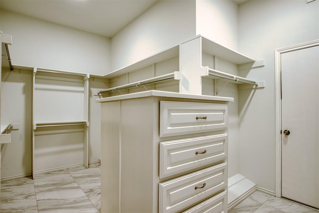 4564 Hitching Post Lane Plano, TX 75024 - Photo 22 of 40 a view of walk in closet with empty racks