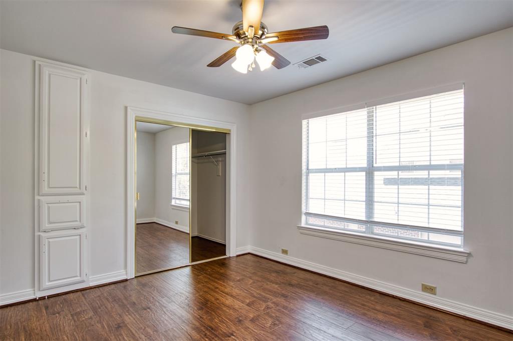 4564 Hitching Post Lane Plano, TX 75024 - Photo 28 of 40 a view of an empty room with window and wooden floor