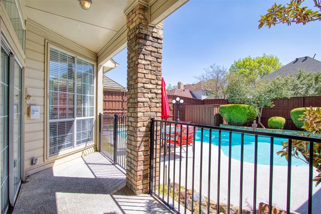 4564 Hitching Post Lane Plano, TX 75024 - Photo 37 of 40 a view of a balcony with wooden floor