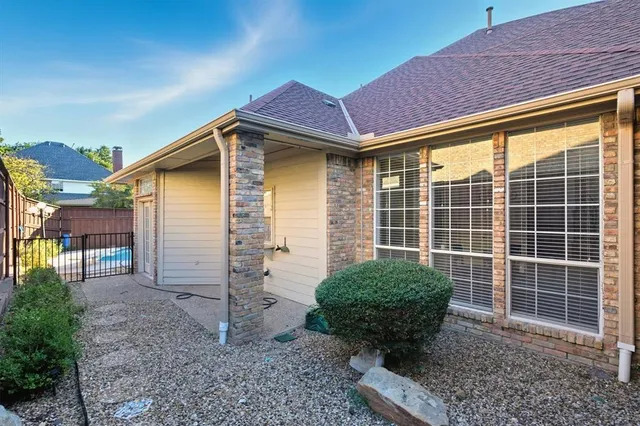 a view of a refrigerator in kitchen and a white cabinet