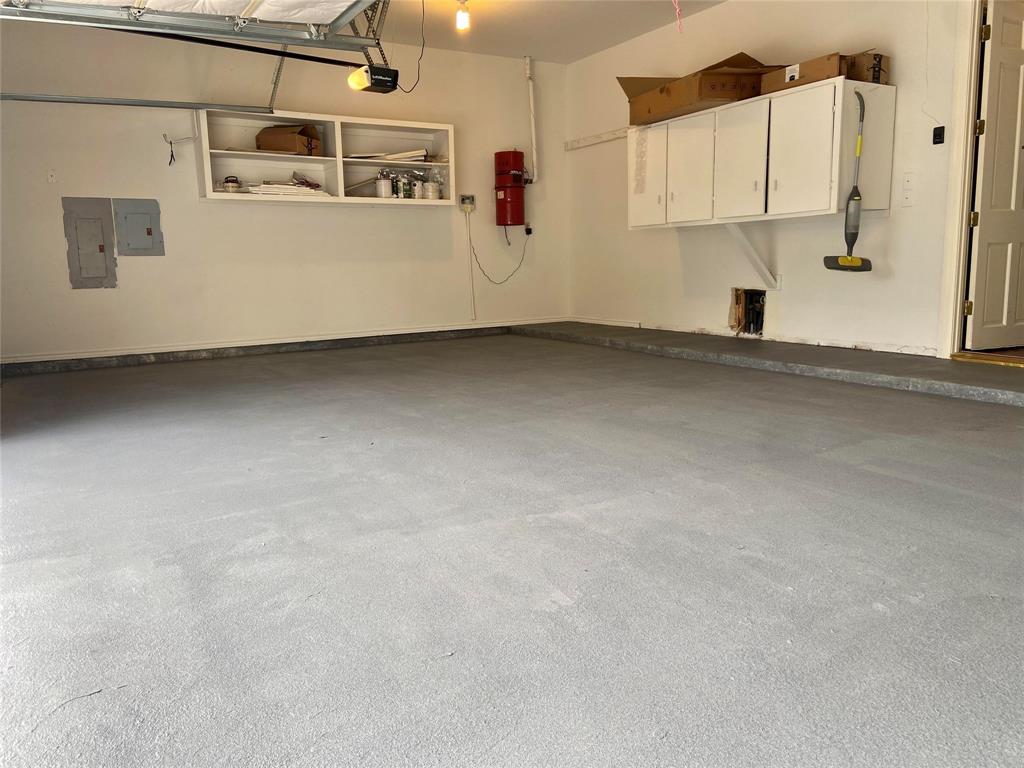 4564 Hitching Post Lane Plano, TX 75024 - Photo 39 of 40 a view of a refrigerator in kitchen and a white cabinet