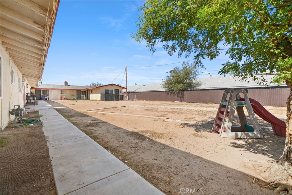 13341 Navajo Road Apple Valley, CA 92308 - Photo 6 of 16 a view of a backyard of the house