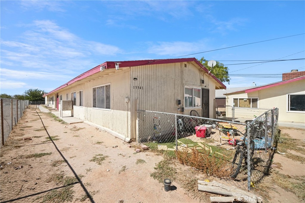 13341 Navajo Road Apple Valley, CA 92308 - Photo 7 of 16 a front view of a house with a patio