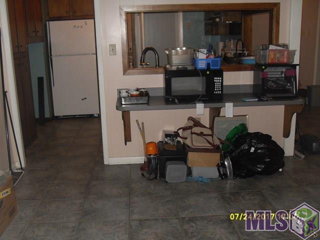 163 Sycamore Street Raceland, LA 70394 - Photo 3 of 11 Dining room & kitchen
