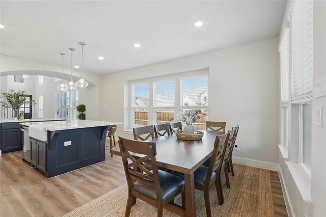 a view of a dining room with furniture and window
