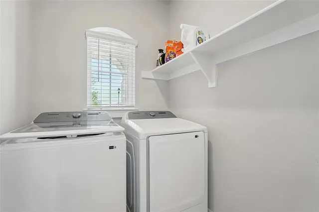 a utility room with dryer and washer