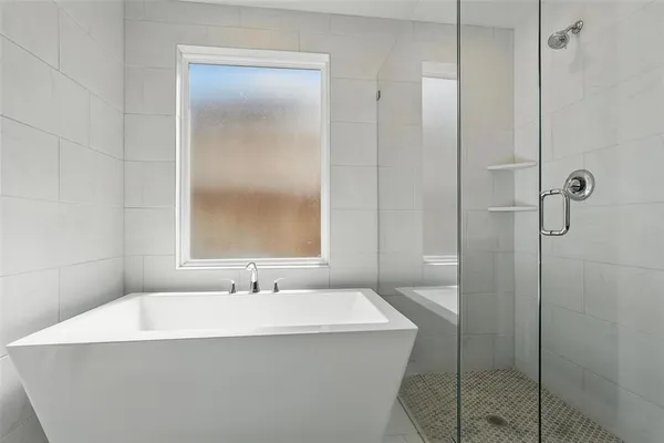 a bathroom with a sink a mirror and a shower