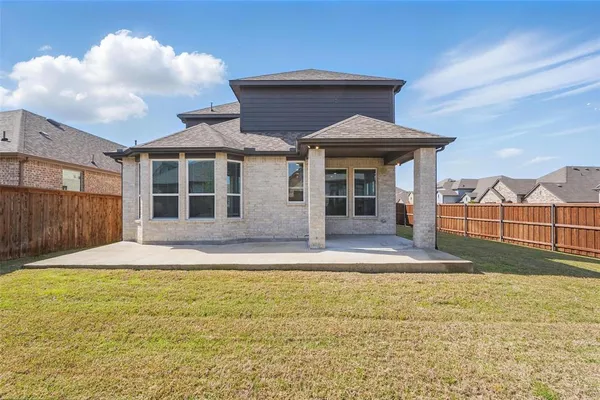 a house view with swimming pool in front of it